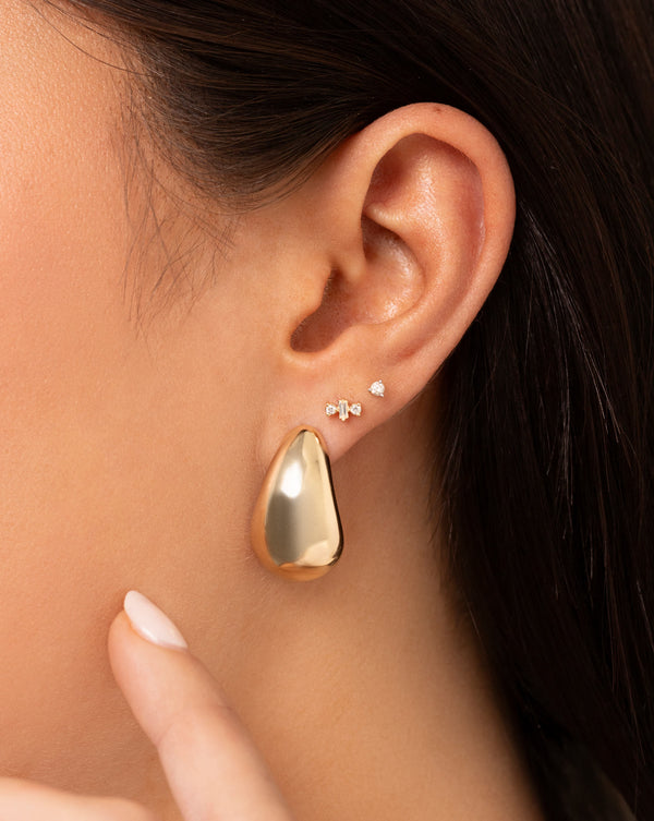 Bold Gold Cloud Earrings on model styled with 2 studs