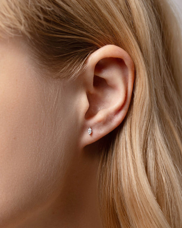 Close up image of the Tiny Marquise Stud on ear of model