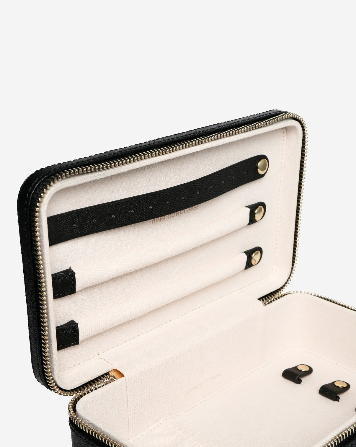 Close up image of the top of the Multiway Leather Jewelry Case showing the ring and earring bars.