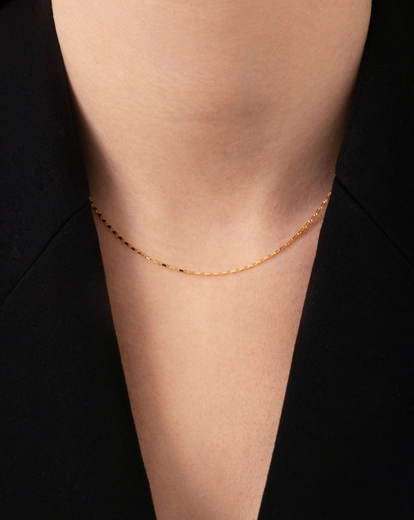 Delicate Link Chain Necklace shown on neck of model