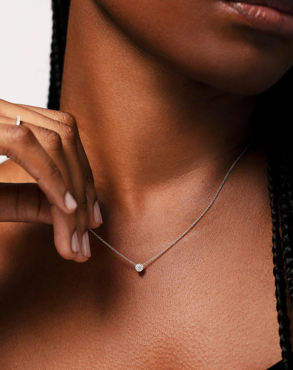 Diamond Cluster Pendant Necklace on model wearing black top