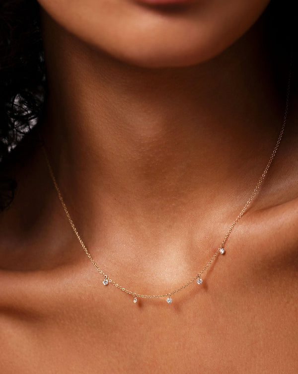Floating Diamond Necklace close up image on neck of model