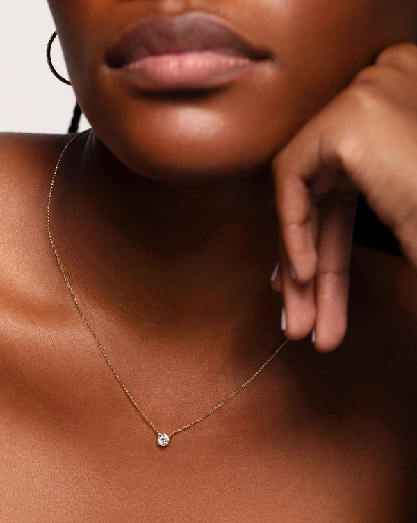 Half Carat Floating Diamond Necklace shown around neck of model