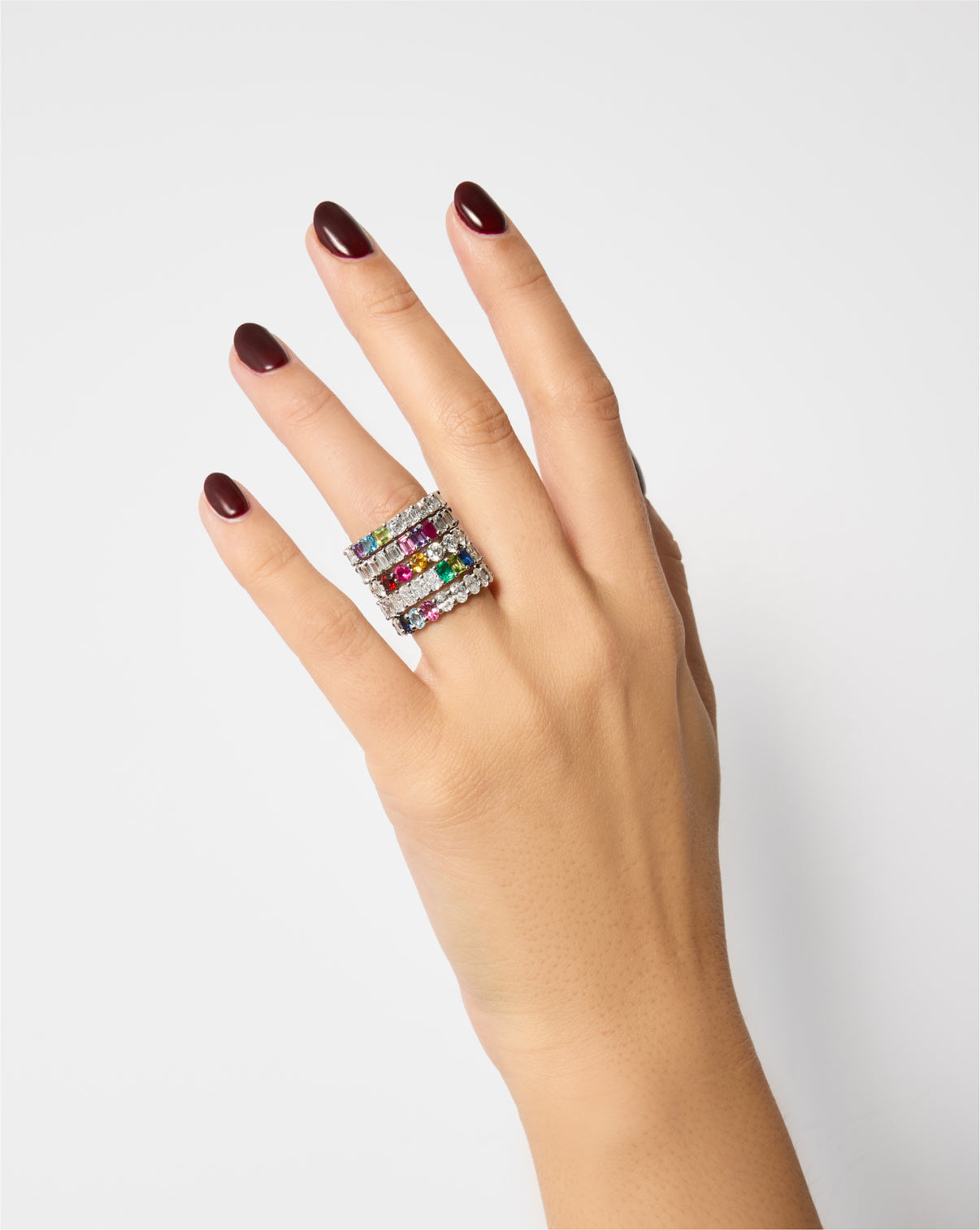 Oval Diamond and Birthstone Eternity Band stacked with several diamond and multi colored birthstone bands on one finger Oval Lab Diamond and Birthstone Eternity Band Petite Classic Luxe Platinum 14k Yellow Gold 14k Rose Gold