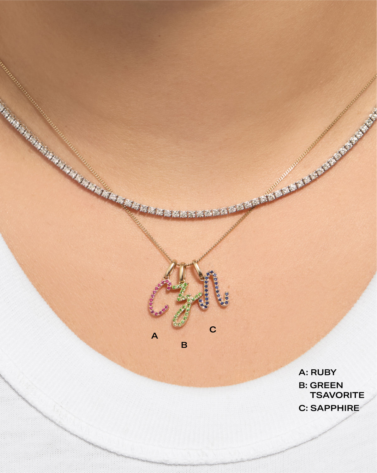 Gemstone Script Initial Necklace shown in all 3 gemstone options with labels and a tennis necklace on model