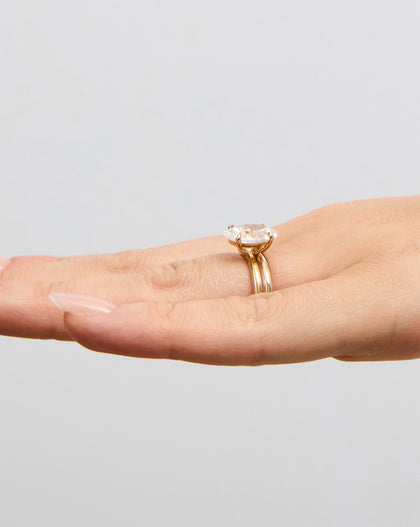 2 mm Cloud Band with Birthstone styled with engagement ring showing side angle global