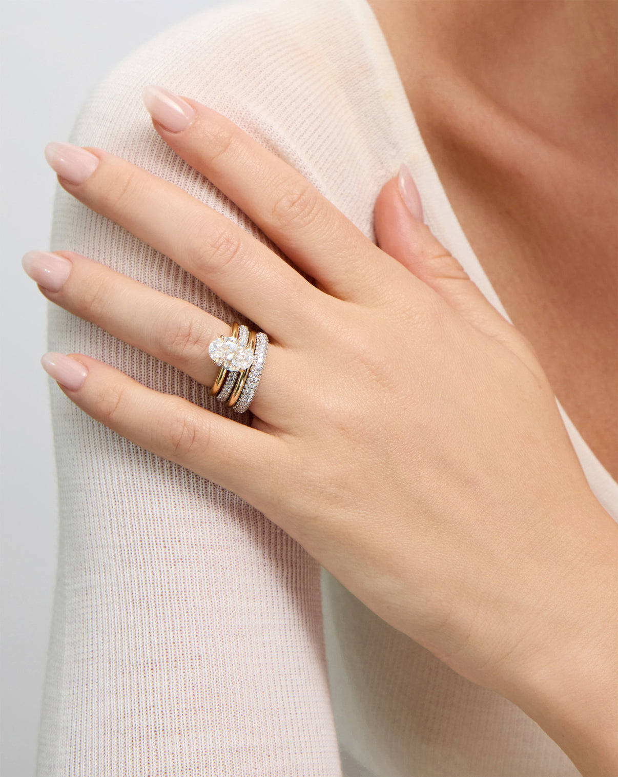 2 mm Cloud Band with Birthstone styled with oval engagement ring and 2 other pavé cloud rings on same finger global