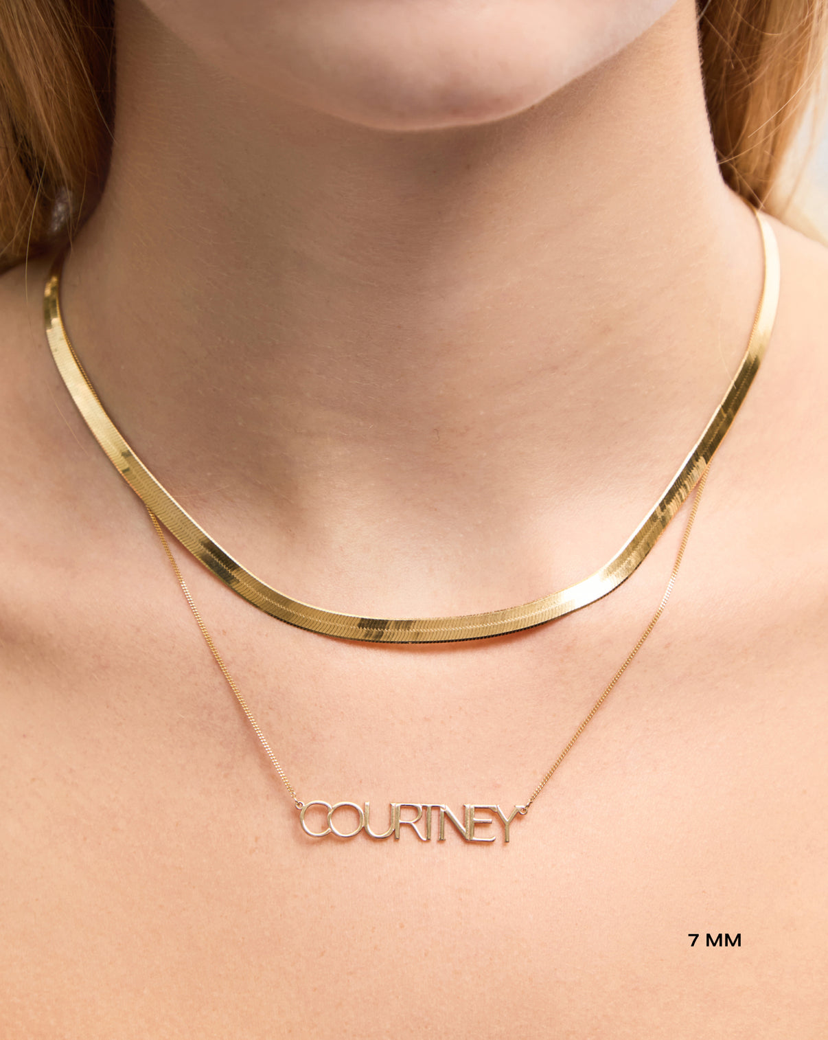 Personalized Block Name Necklace 7 mm styled with herringbone necklace on model global