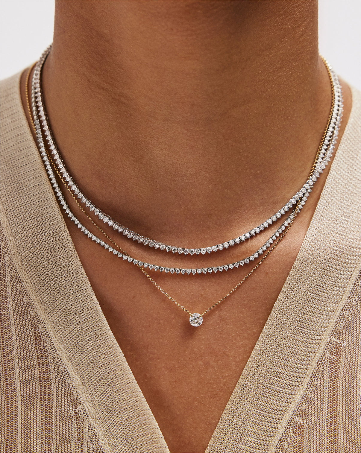 Model wearing versatile Martini Diamond Tennis Necklace in 14k gold, perfect for layering or wearing alone as a statement piece global