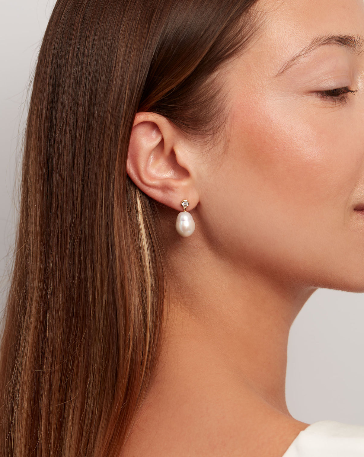 Organic Pearl + Diamond Earrings on model with brown hair
