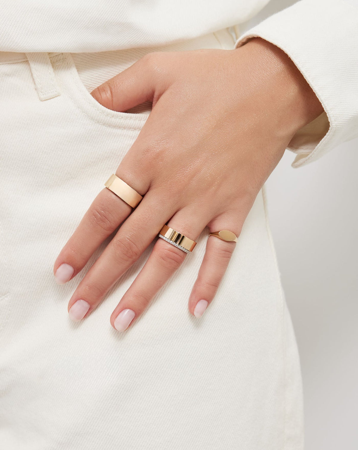 Model wearing Perfect Pave Diamond Ring in Platinum and 3 other rings