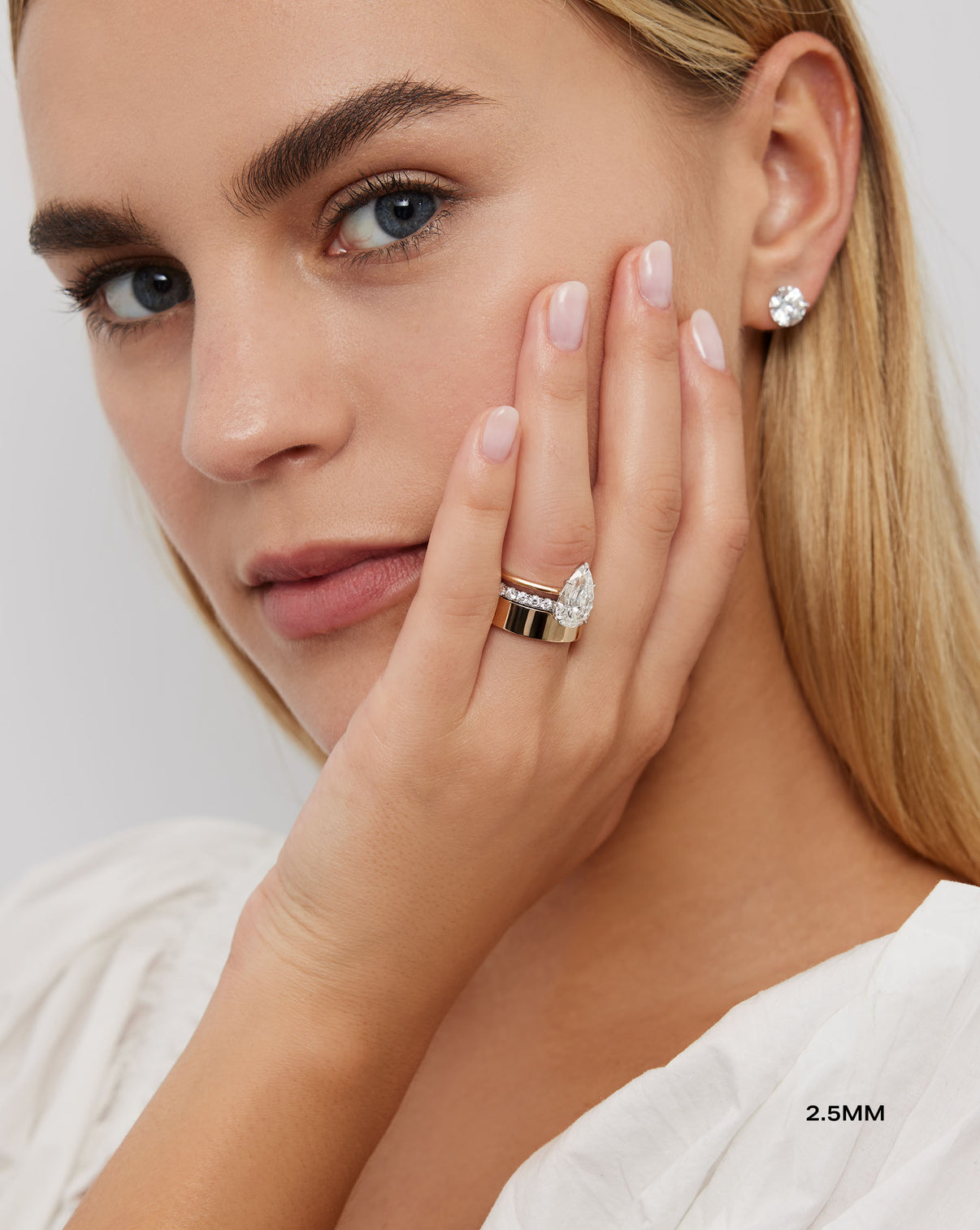 Model wearing 2.5 mm Perfect Pave Diamond Ring in Platinum and 2 other rings