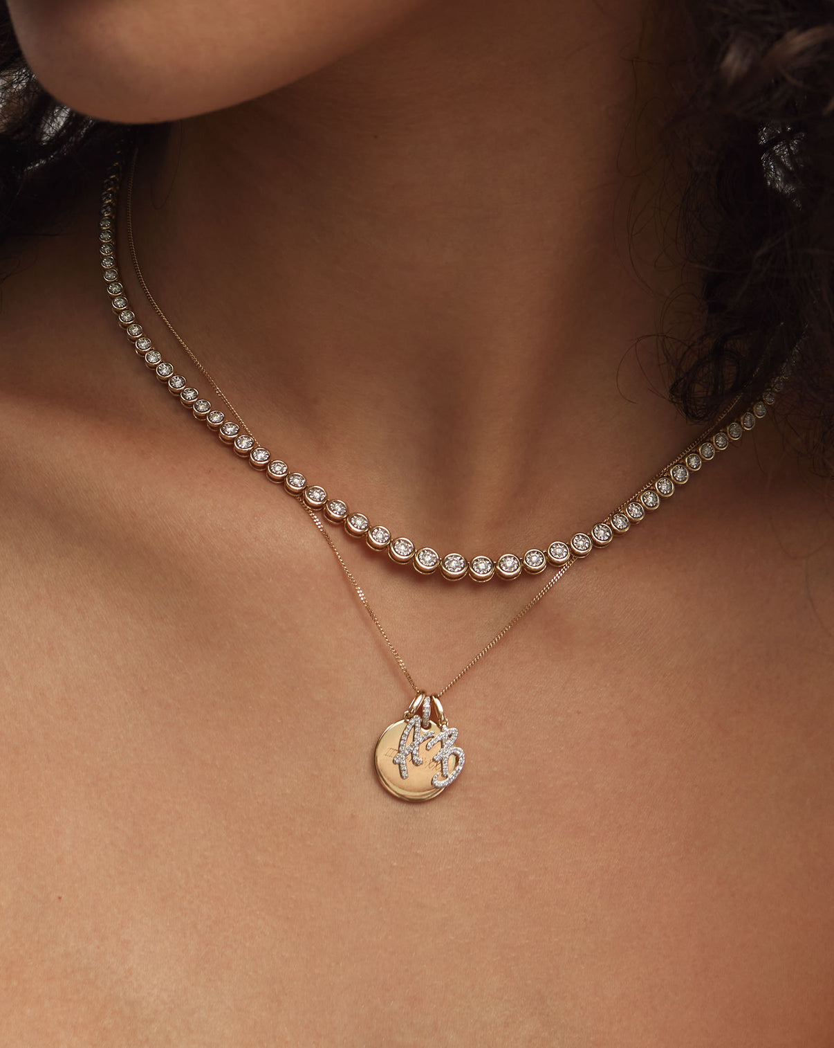 Diamond Script Initial Necklace styled on model with round engravable pendant and other Diamond Script Initial Pendant