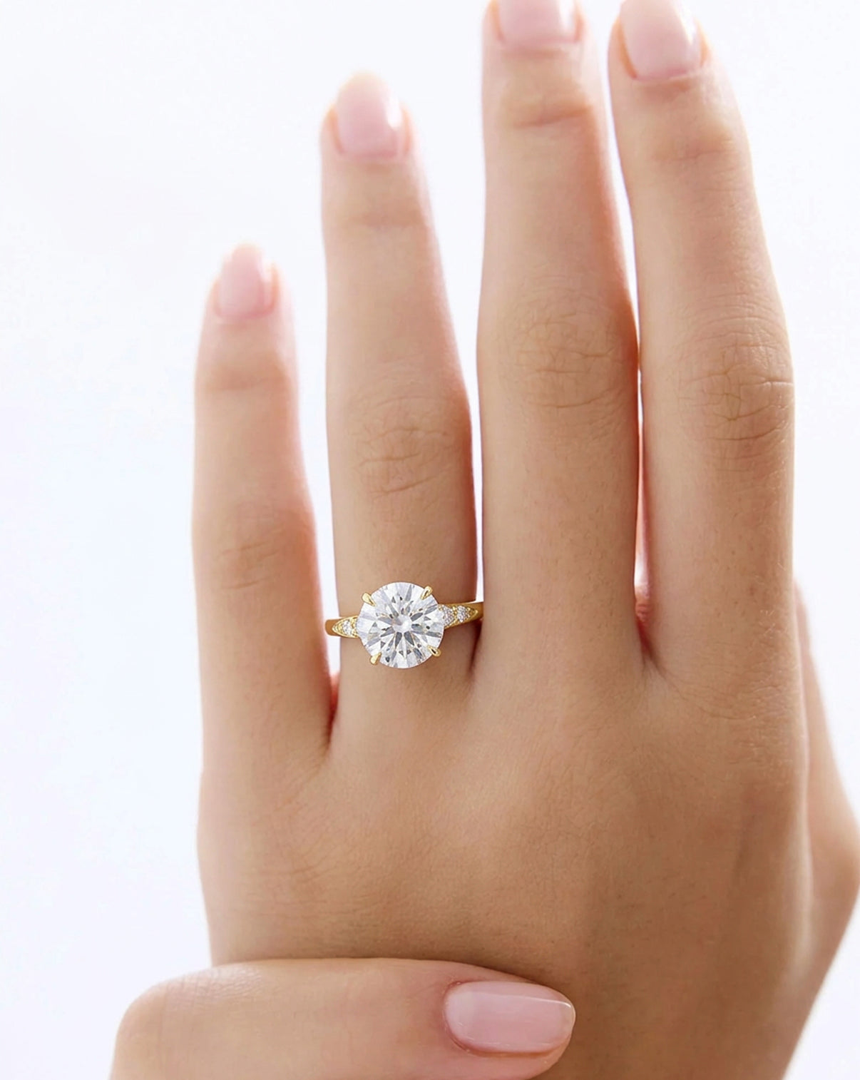 The Celeste
Yellow Gold Engagement Ring close up on hand43934988664920 43934798086232 43934985912408