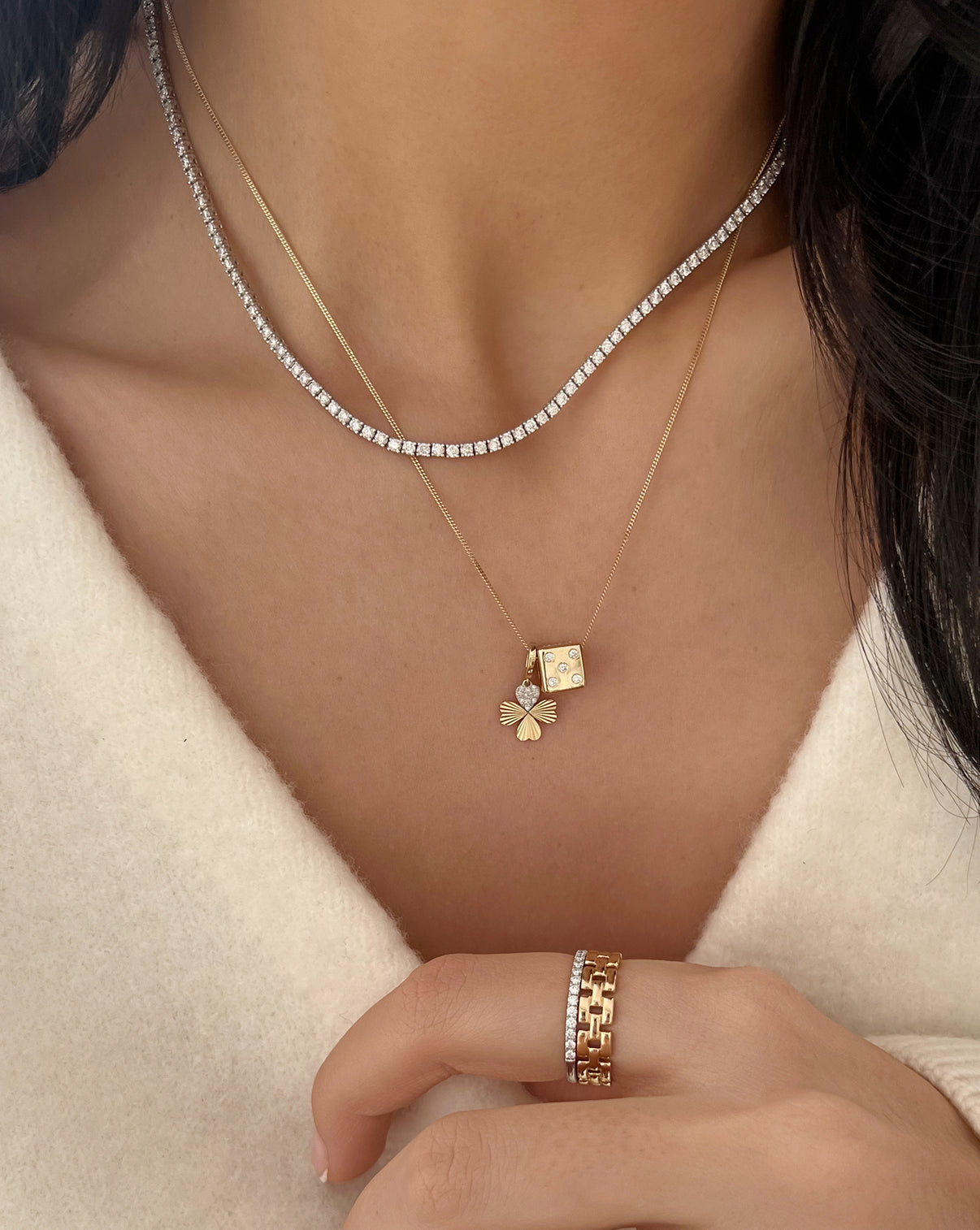 Clover charm and Dice Bead on Yellow Gold Necklace worn on model styled with a tennis necklace