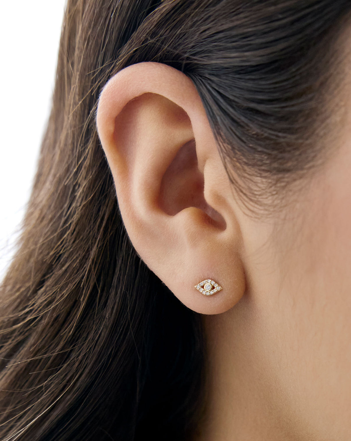 evil eye stud shown on ear