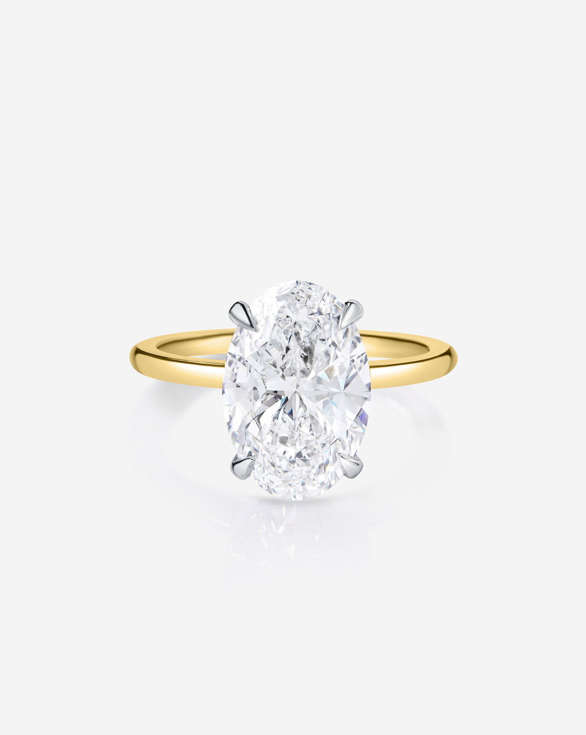 Close up 2.60 carat Oval ring of the 4.70 Oval & Pear Whisper Thin® Duet diamond Engagement ring in 14K Yellow Gold