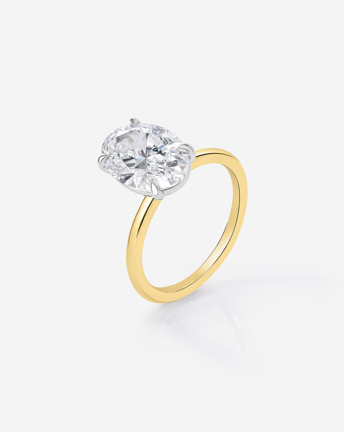 side view close up of the 2.60 carat Oval ring of the 4.70 Oval & Pear Whisper Thin® Duet diamond Engagement ring in 14K Yellow Gold