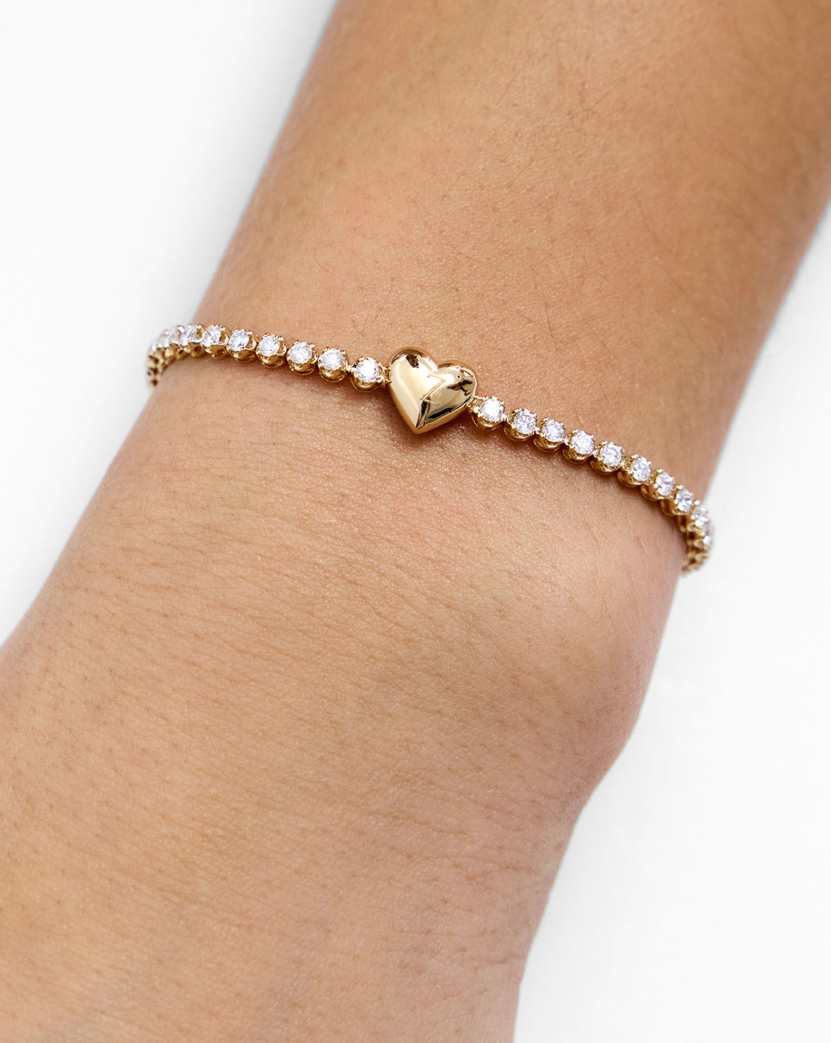 14K Yellow Gold Heart Lab Diamond Tennis Bracelet shown without engraving on model's arm