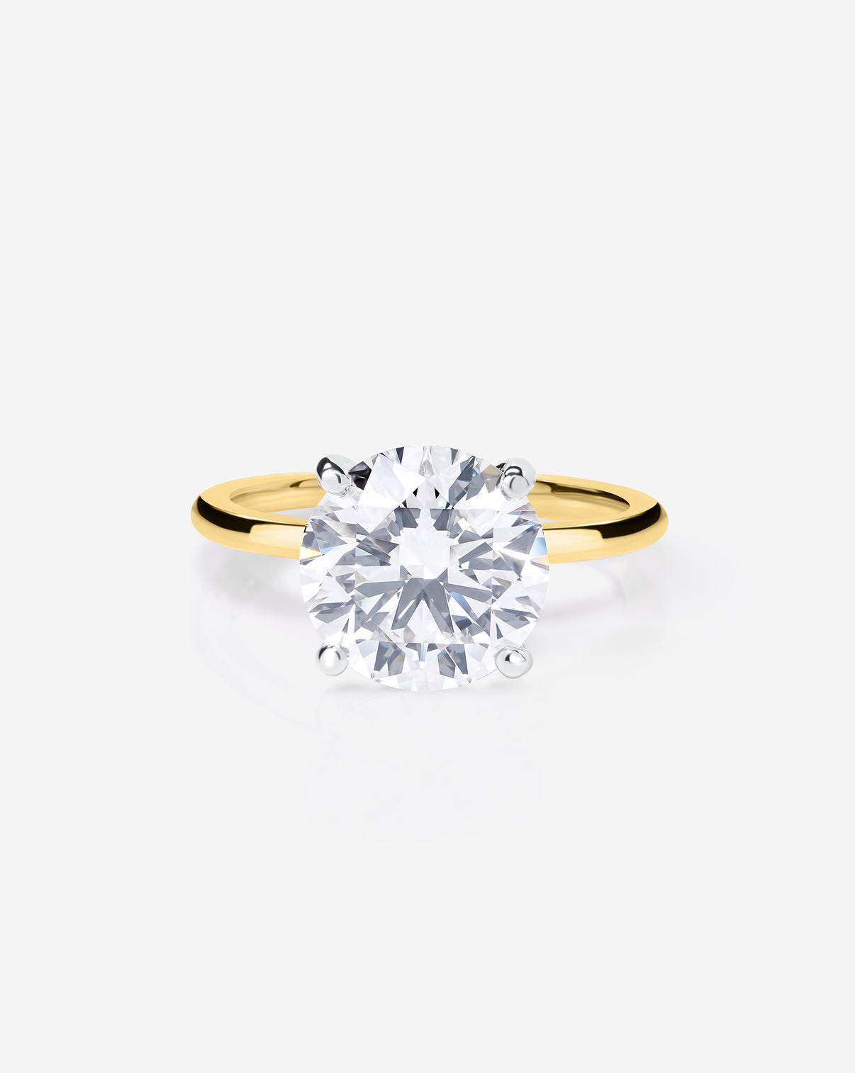 Close up 2.57 carat Round ring of the 4.70 Oval & Pear Whisper Thin® Duet diamond Engagement ring in 14K Yellow Gold