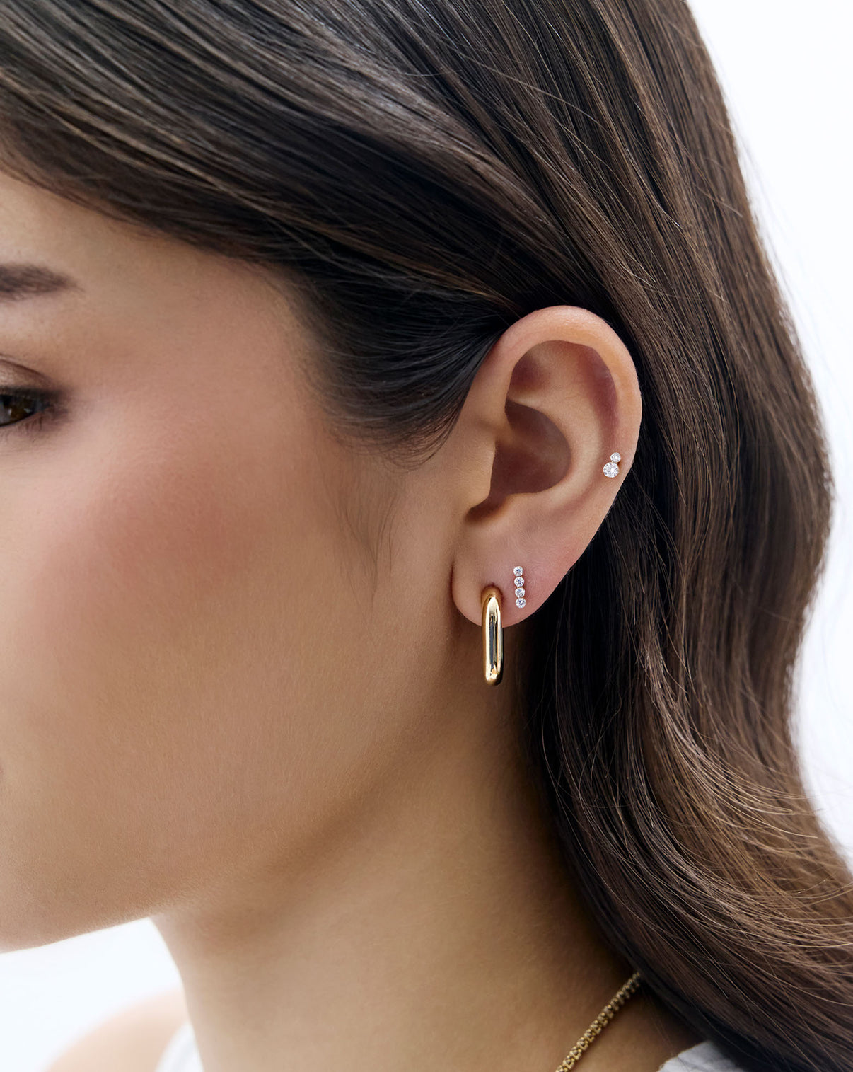 Duo Lab Diamond Flatback earring styled on model's ear and styled with a gold link earring and the 4-Lab Diamond Flatback Earring 