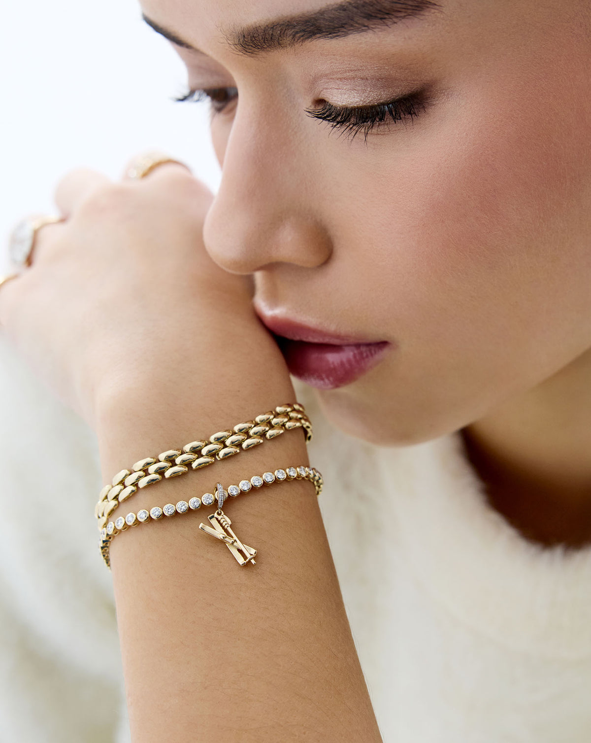 ski charm styled on tennis bracelet on-model