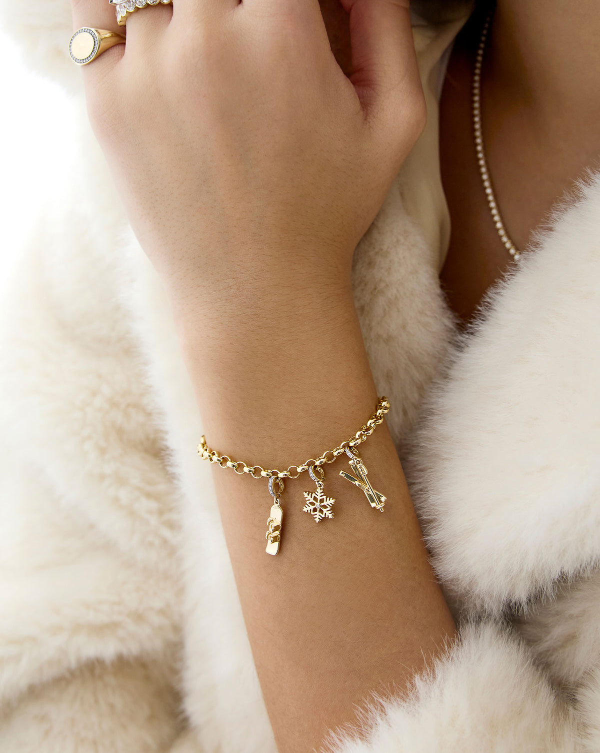 snow inspired charms styled on-model in charm bracelet
