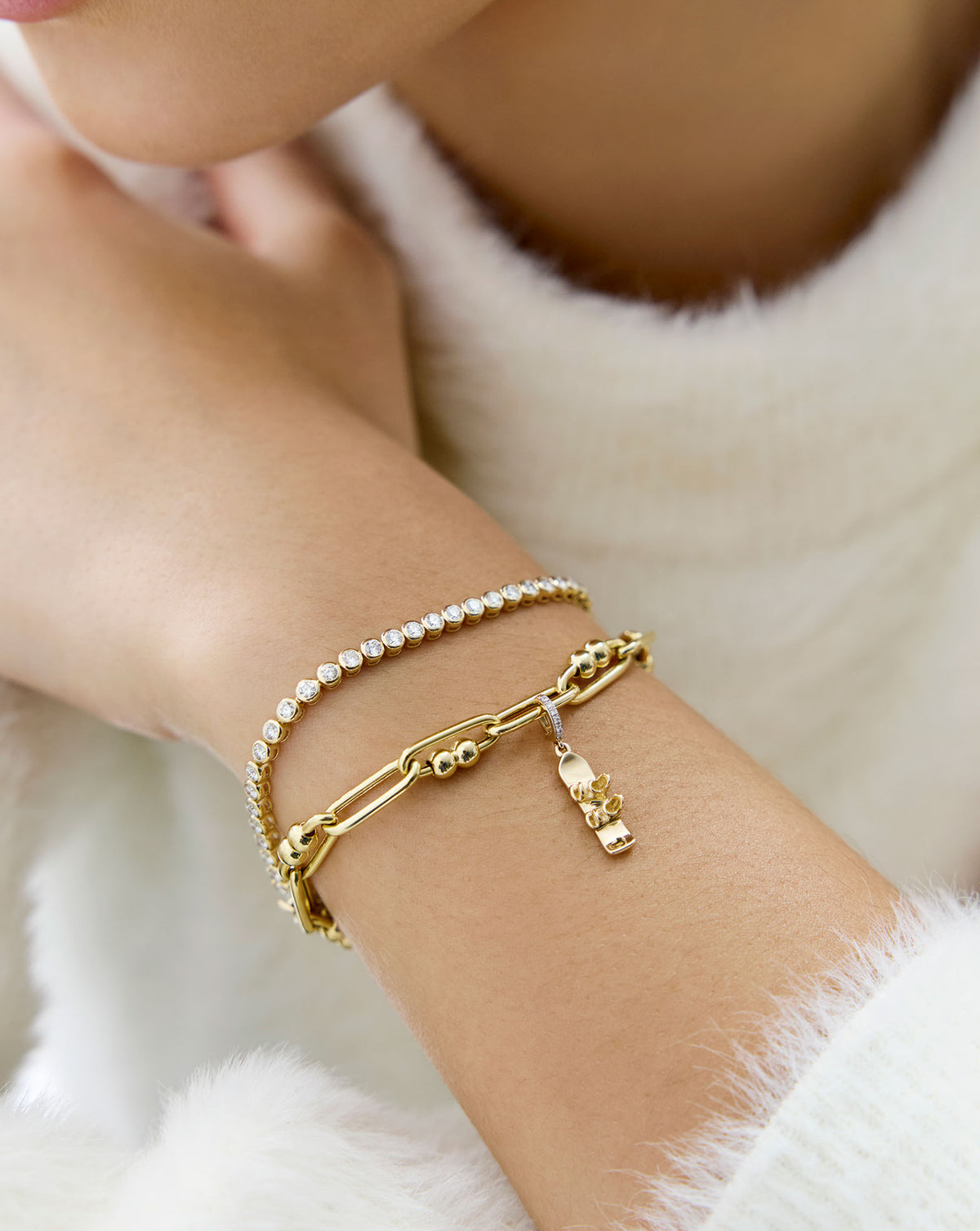 snowboard charm styled on-model with tennis bracelet up close