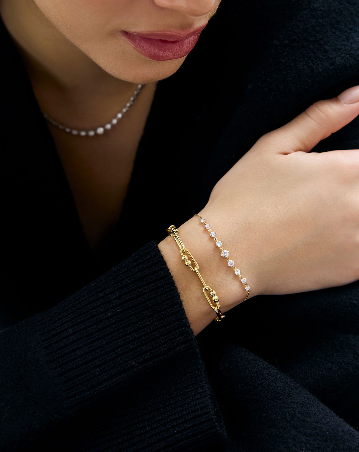 model wearing Starlight Lab Diamond Bar Bracelet in 14K Yellow Gold styled with a mixed link chain bracelet