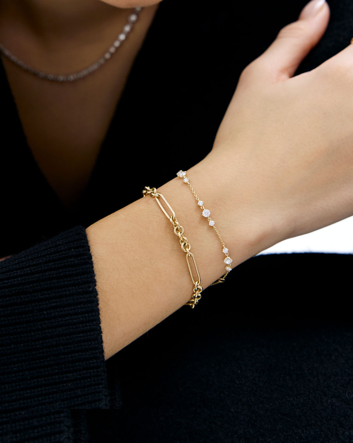 model wearing Starlight Lab Diamond Bracelet styled with a mixed link chain bracelet
