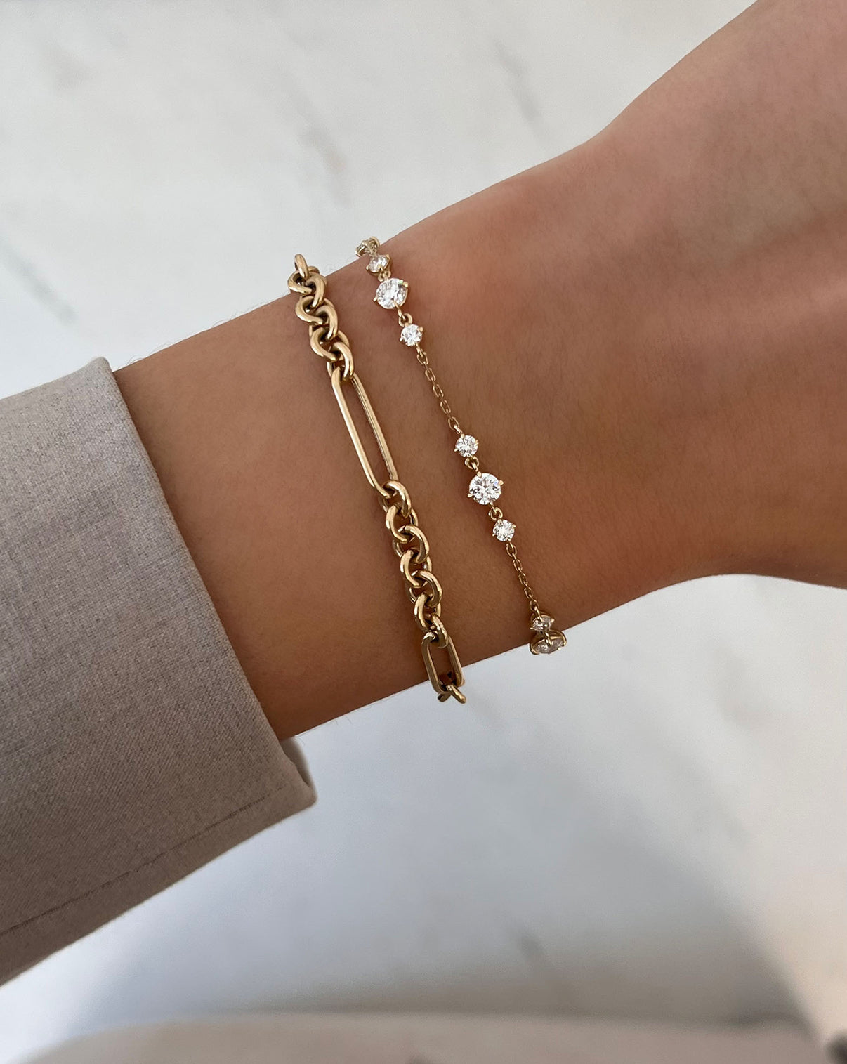 Starlight Lab Diamond Bracelet in 14K Yellow Gold styled with a chain link bracelet on model's wrist