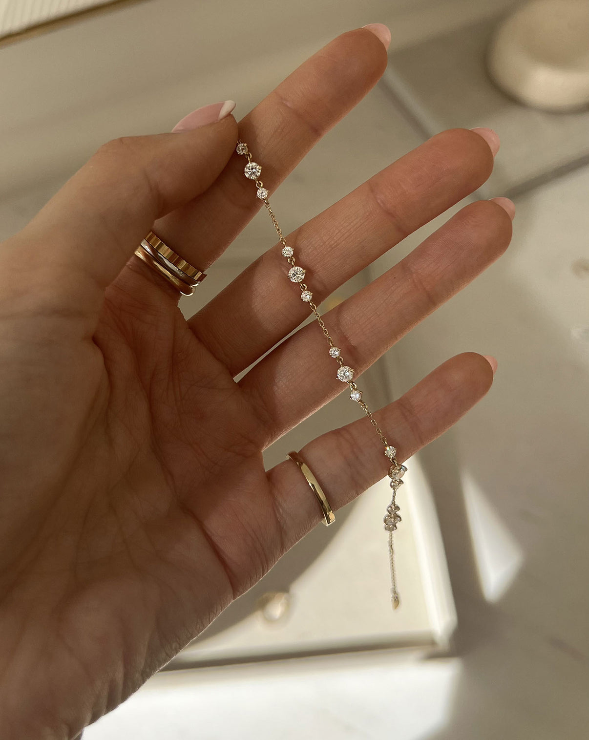 close up of a hand holding the Starlight Lab Diamond Bracelet