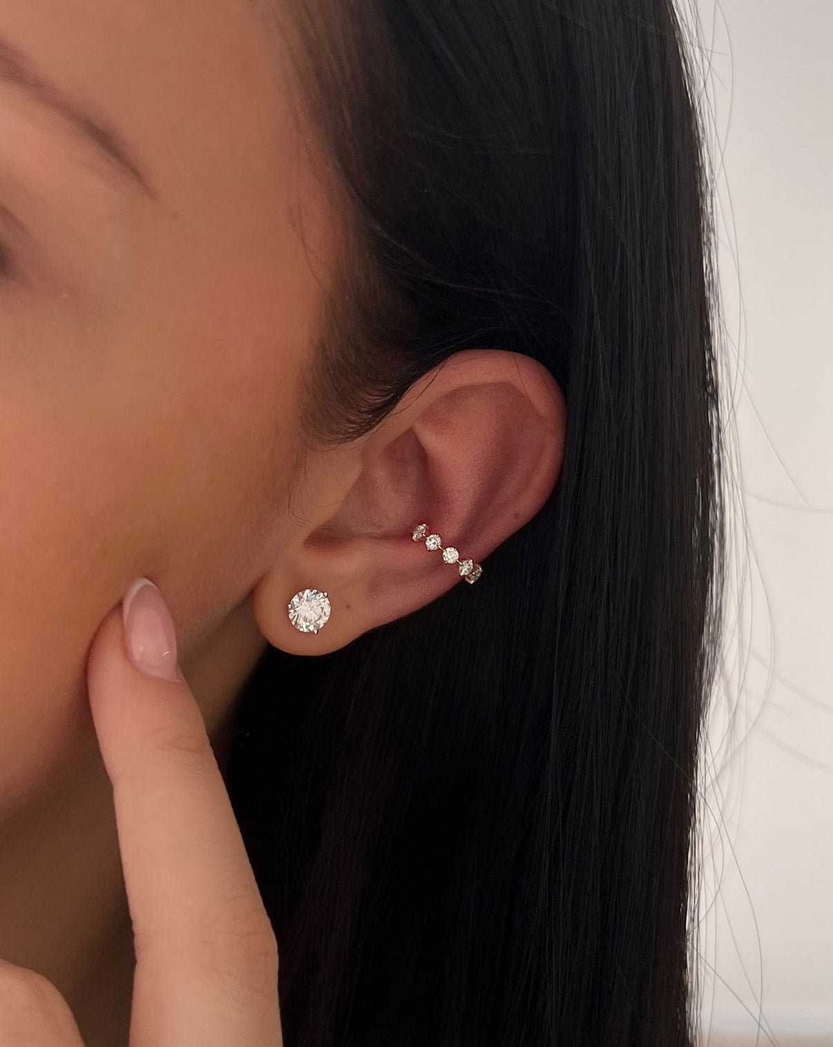 Starlight Lab Diamond Ear Cuff shown on model's ear with round diamond stud earring