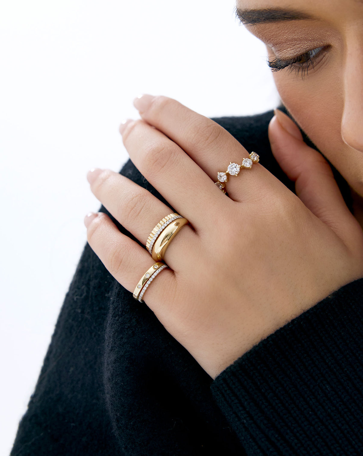 Starlight Lab Diamond Ring in 14K Yellow Gold styled on model's hand with other gold and diamond stacking rings