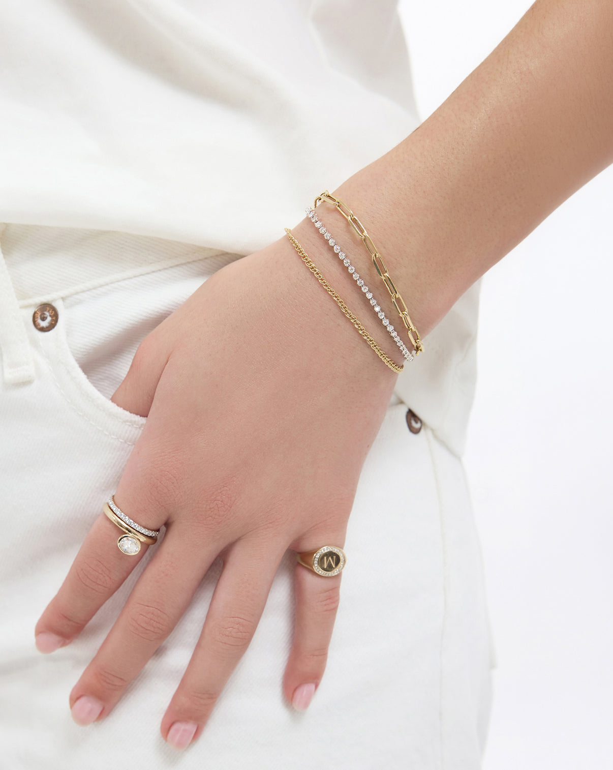Paperclip Chain Bracelet in 14k solid gold paired with our Petite Twin Chain Bracelet and Mini Diamond Tennis Bracelet