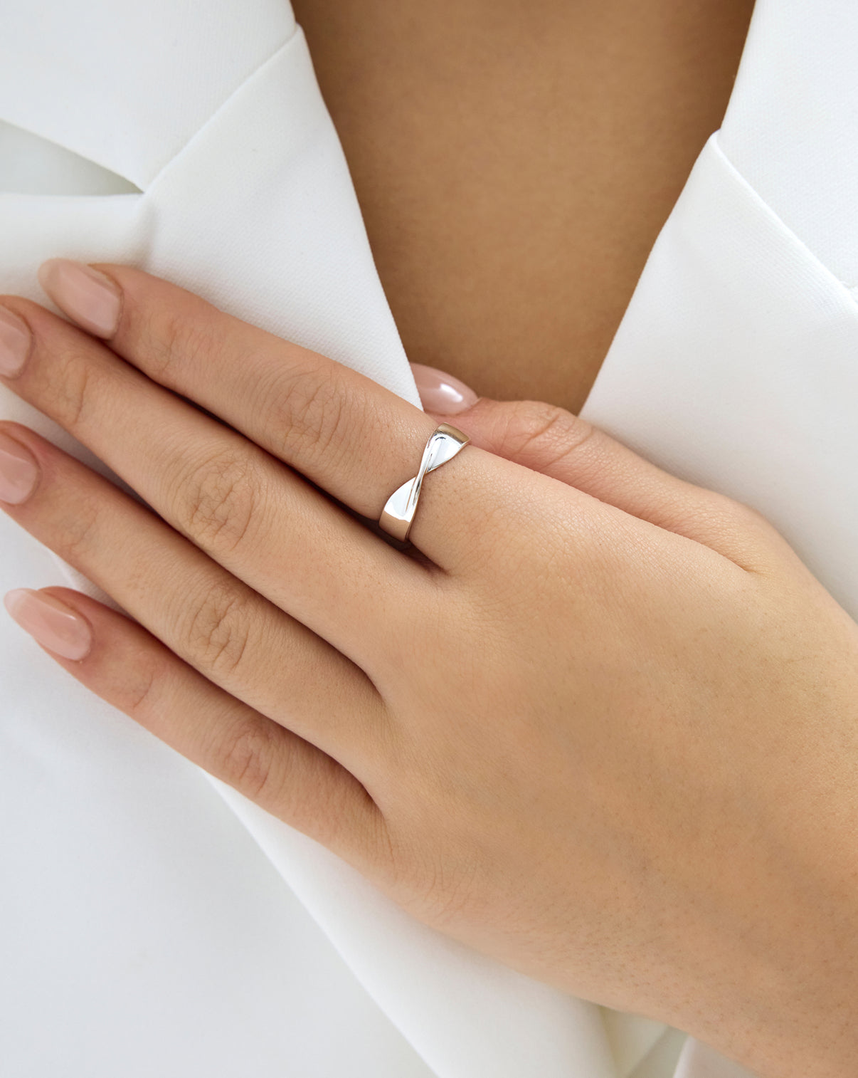 close up view of Silver Twist ring on model's hand