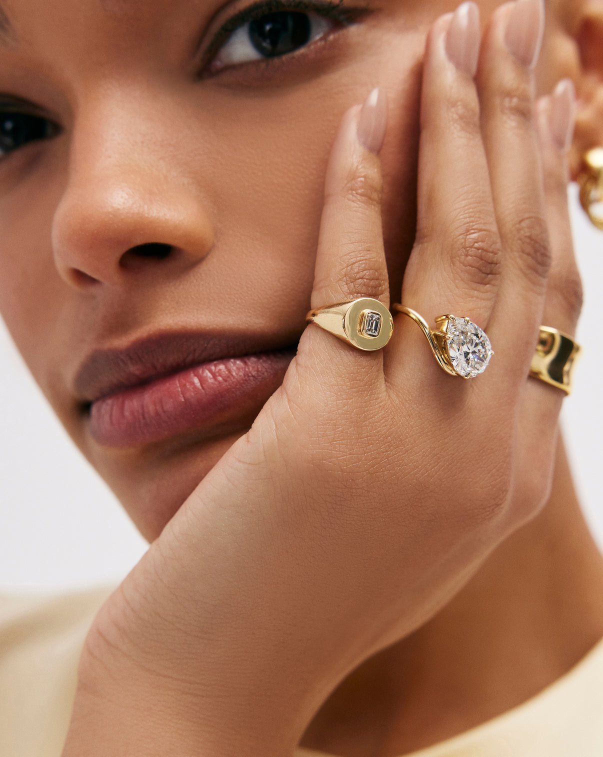 model wearing Ring Concierge 4.32 Pear Lab Diamond in Curve Whisper Thin® 14K Yellow Gold Engagement Ring