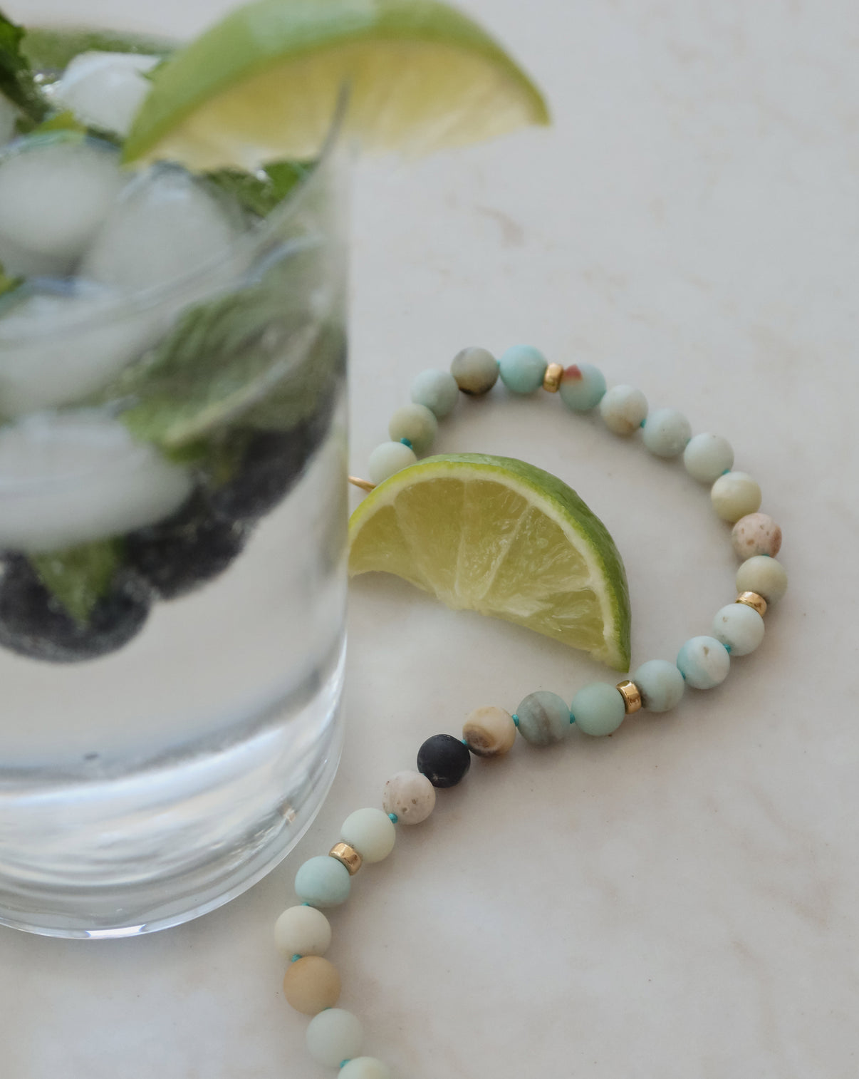 Angled shot of Ocean Spritz Necklace emphasizing the ocean-inspired blue-green tones