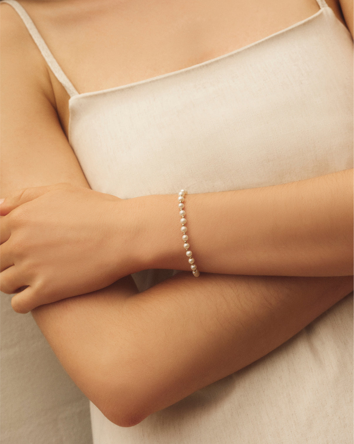 Pearl Station Bracelet worn on wrist, demonstrating the elegant drape and fit