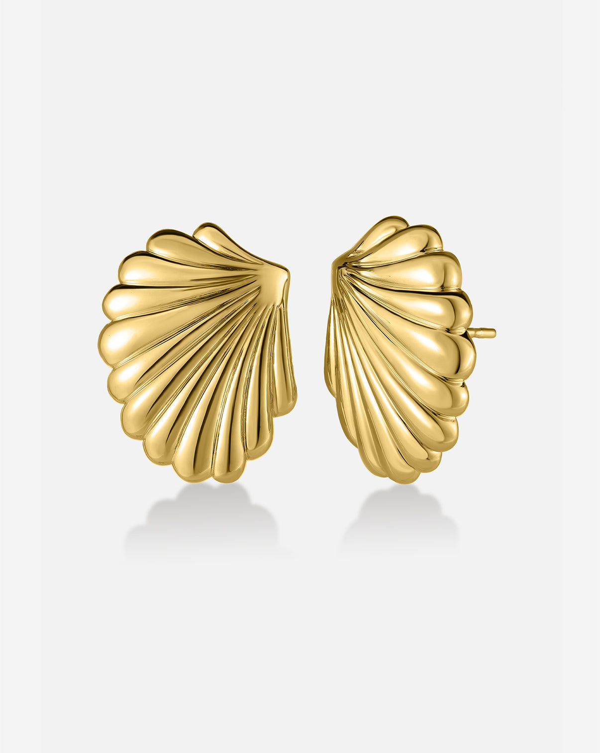 Shell Earrings with sculptural gold design inspired by seashells, shown on white background