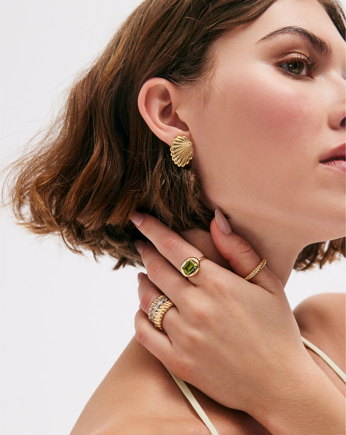 Front view of Shell Earrings displaying the dimensional curved form and light-catching surfaces