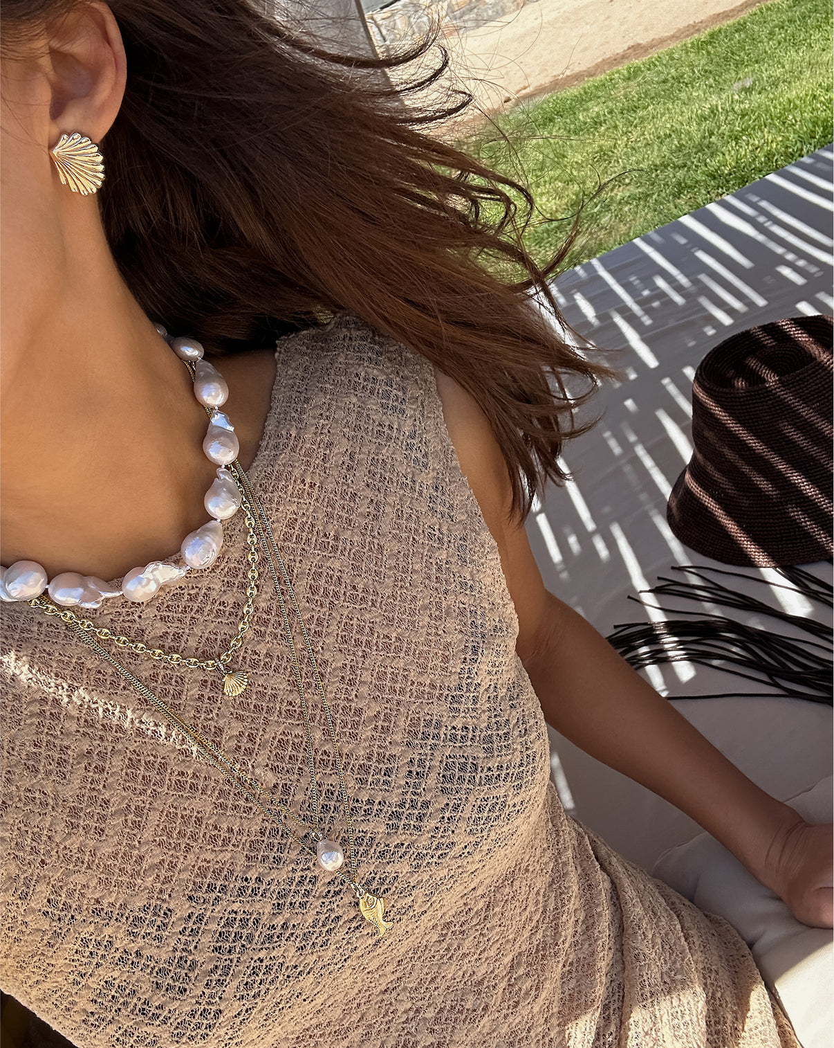summer necklaces layered on-model at the beach