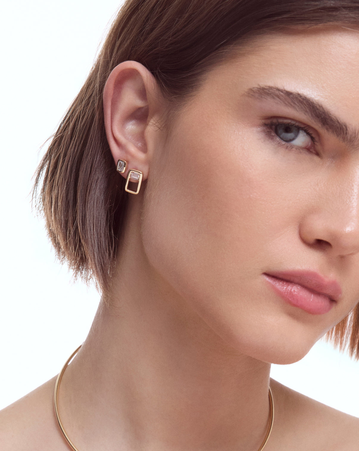 aureum number 19 earrings on model's ear