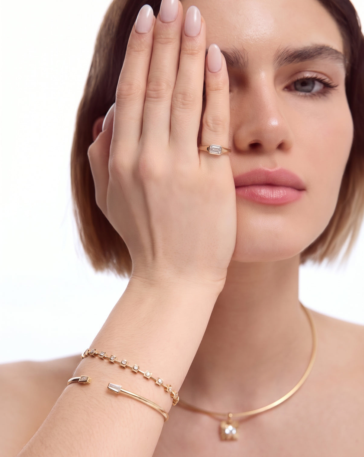 aureum number 19 ring on pinky finger with other aureum bracelets and bangles