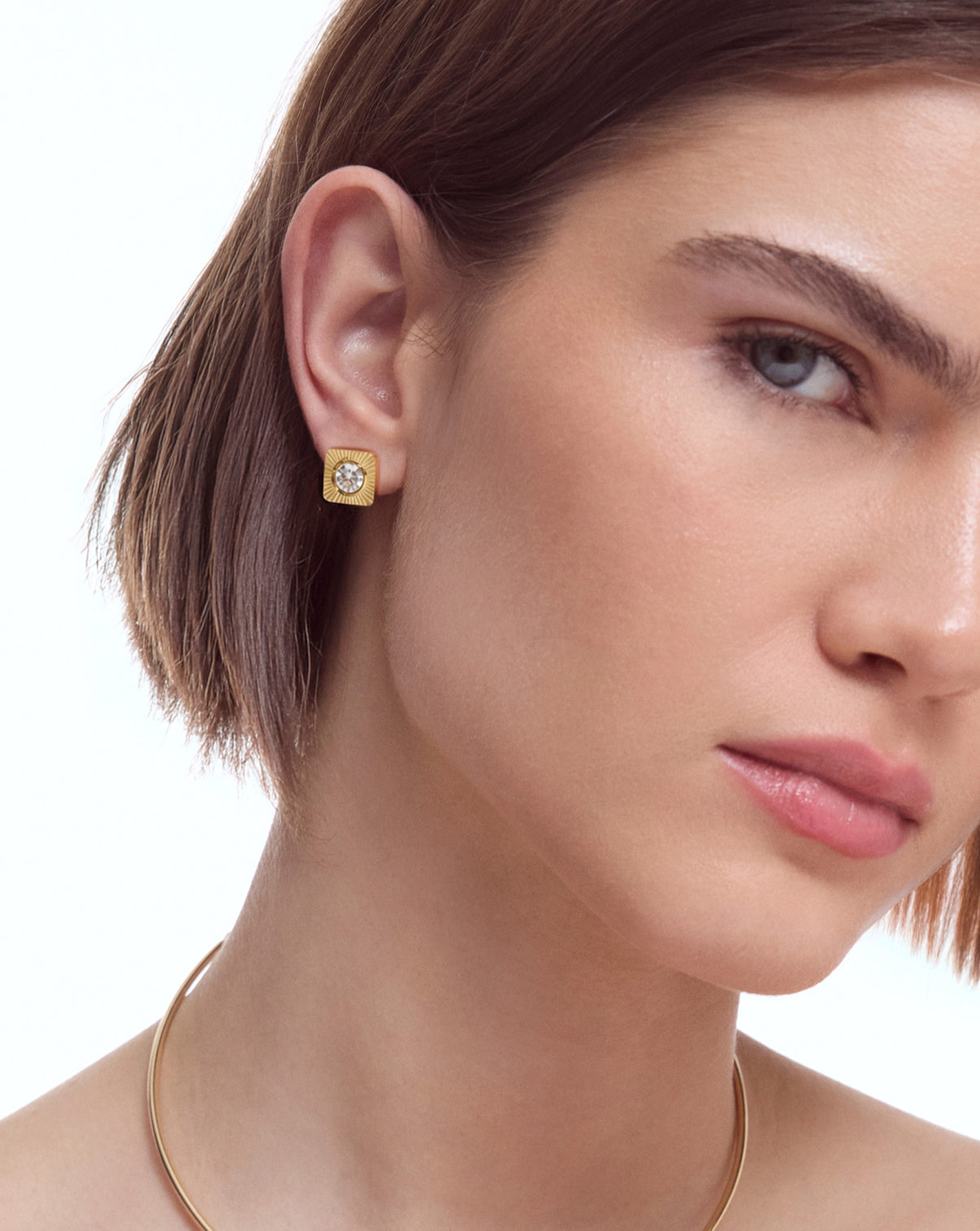 aureum number 2 earrings shown on model's ear