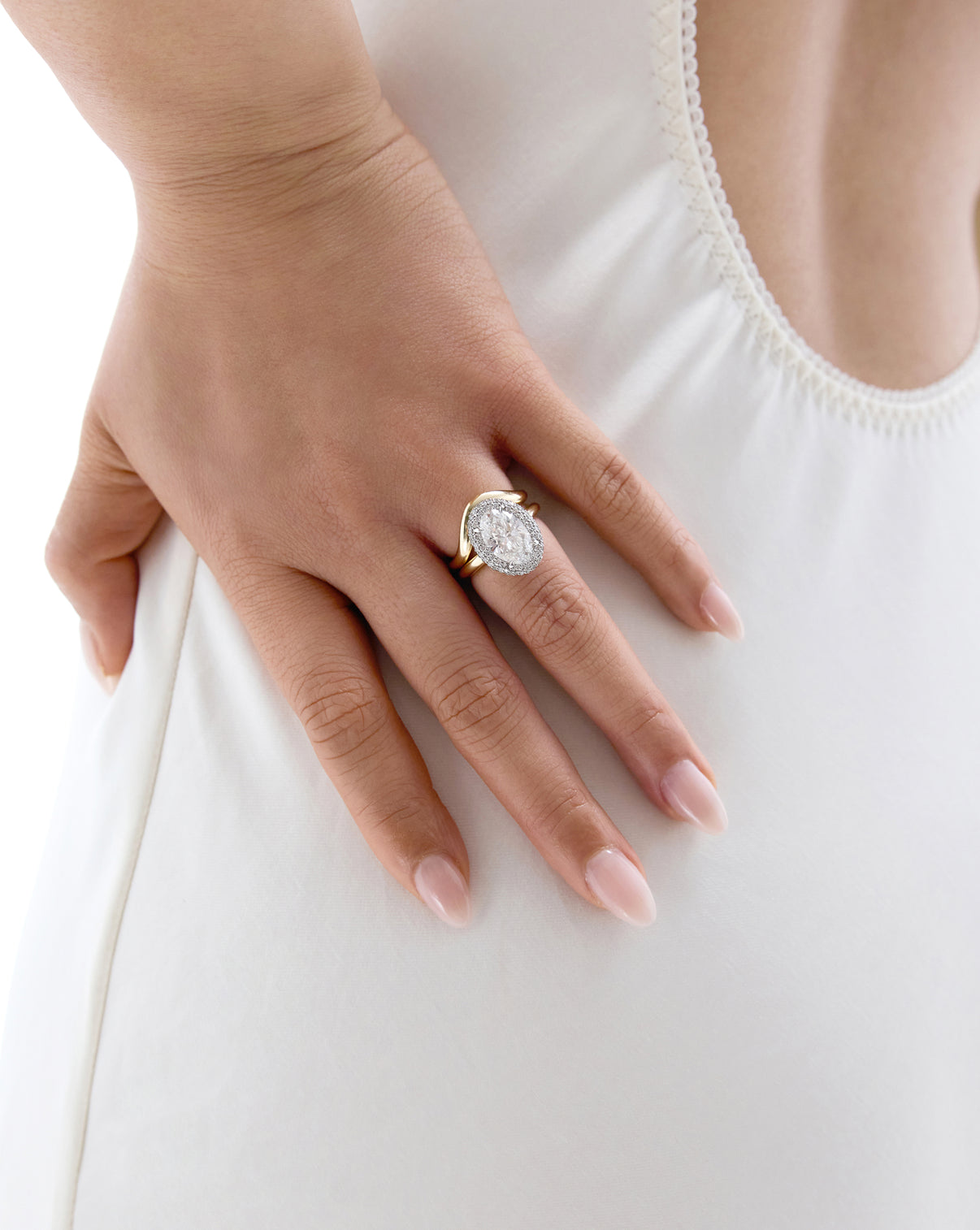 Model wearing Cloud Bezel with Pavé Halo in Yellow Gold worn by model with wedding band 44181311979608 44181328461912 44181328494680