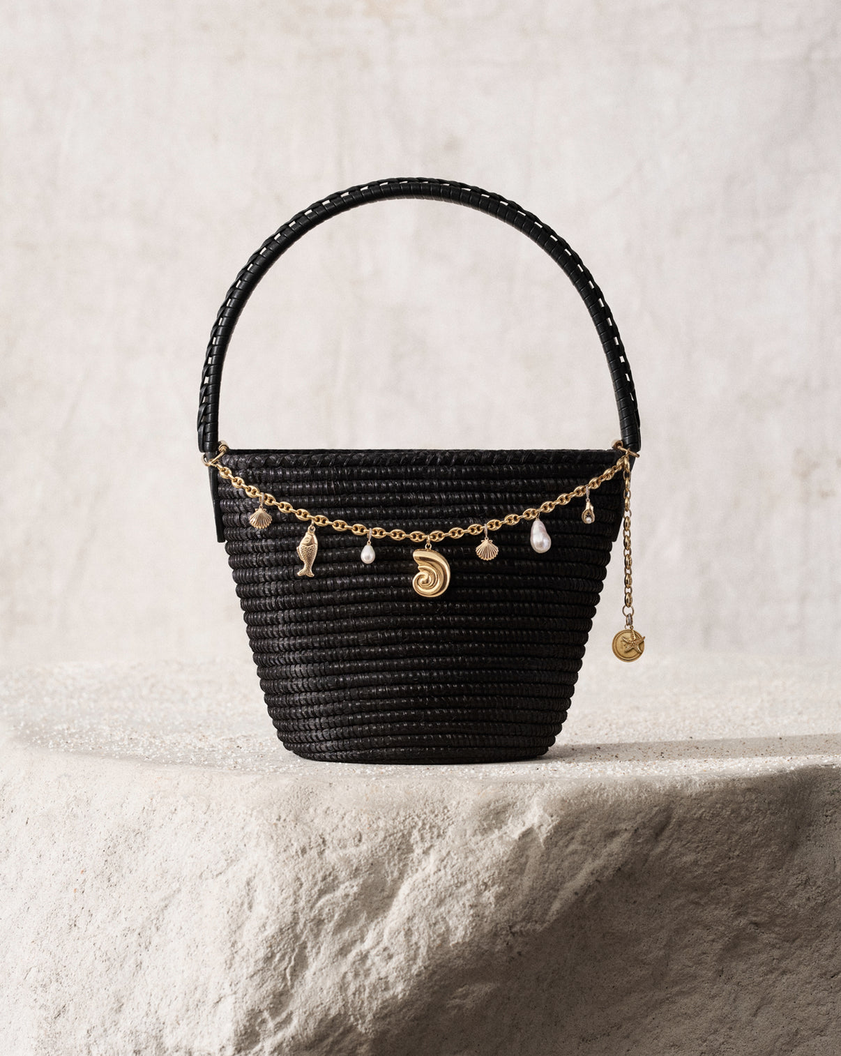 Cesta Collective Ladybag featuring the Ring Concierge Bag Necklace with 14k gold seashell, fish, lobster claw, starfish charms, 14k gold vermeil over 925 sterling silver Nautilus shell and Cesta medallion pendant, and freshwater pearl charms