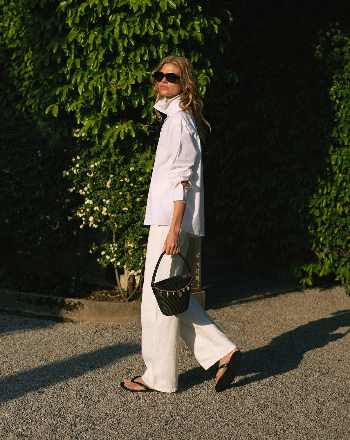 Lifestyle photo of model carrying the RC x Cesta Charmed Ladybag