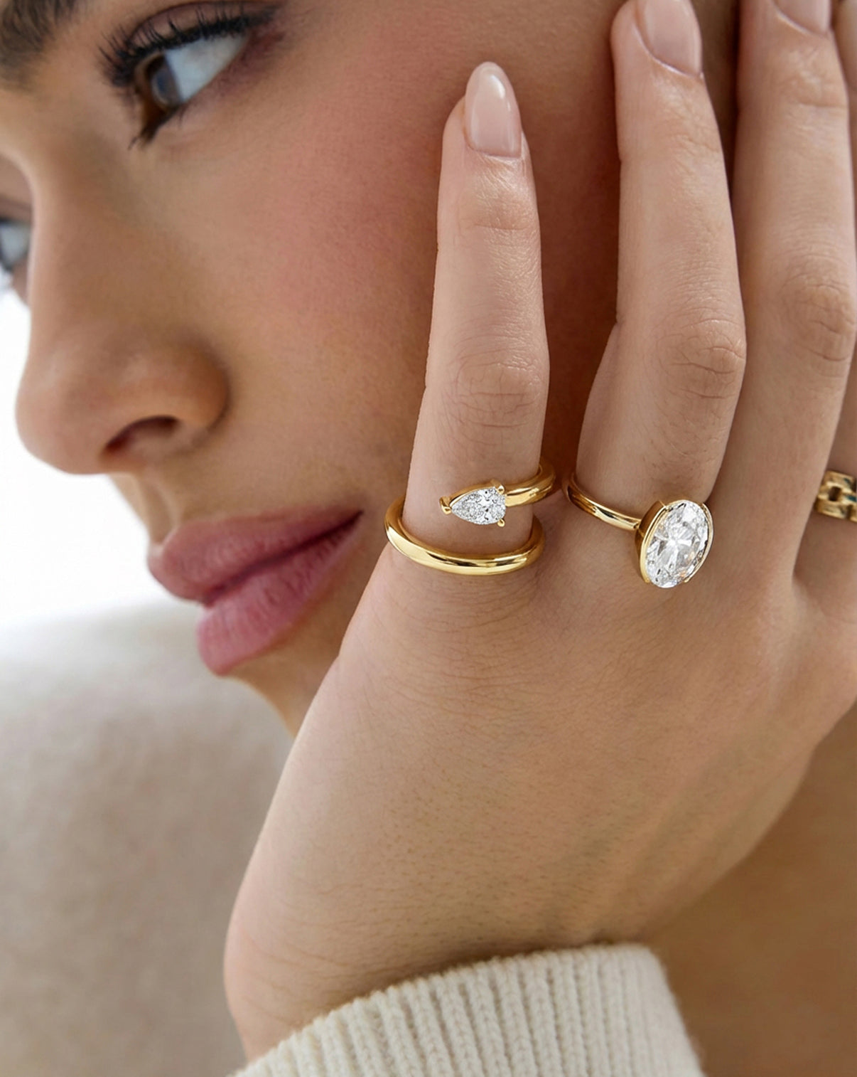 Lab Diamond Double Coil Ring shown on pinky finger with other rings on hand