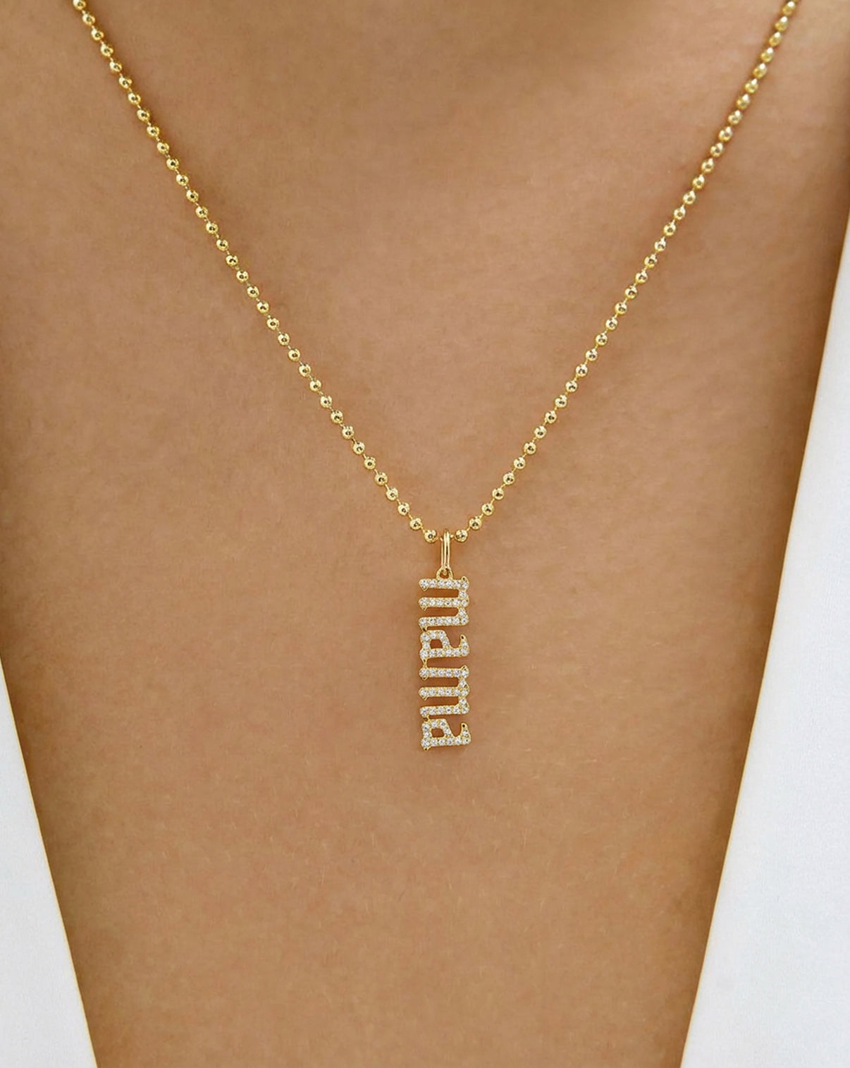 Diamond Mama Pendant shown on a bead chain necklace